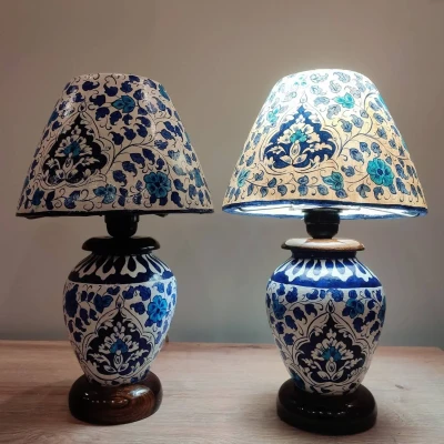 Classic table lamp with a hand-painted blue floral Multani base and matching lampshade, lit from inside to highlight the delicate sapphire bloom design