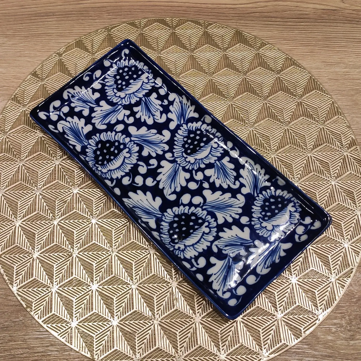 Rectangular ceramic dish with blue Gul Bahar floral pattern on deep navy base, hand-painted Multani pottery.