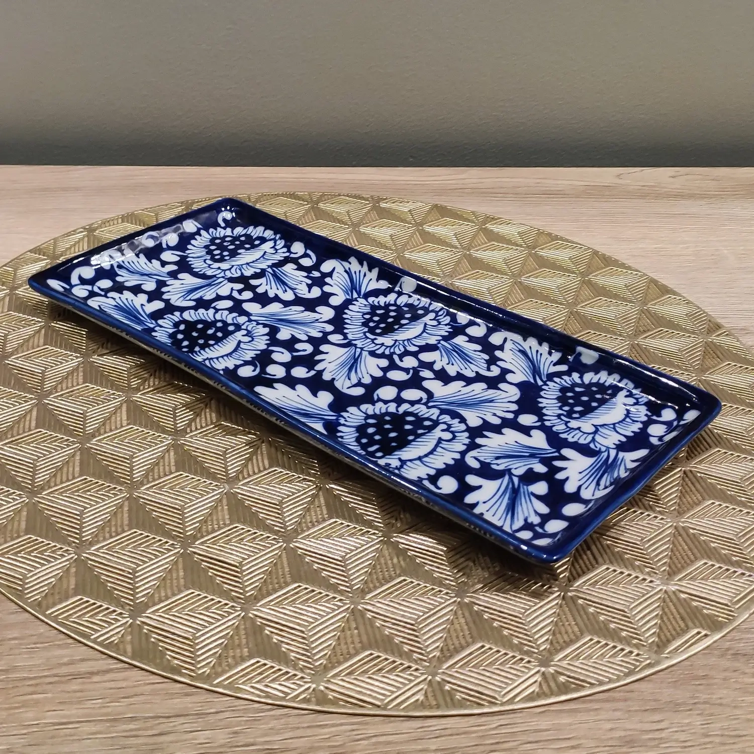 Rectangular ceramic dish with blue Gul Bahar floral pattern on deep navy base, hand-painted Multani pottery.