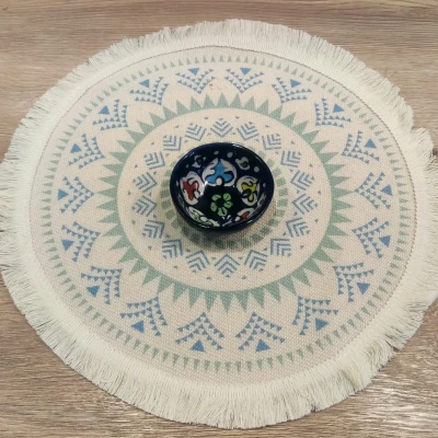mall ceramic dip bowls with dark blue rims and colorful floral patterns inside—featuring red, yellow, and blue accents