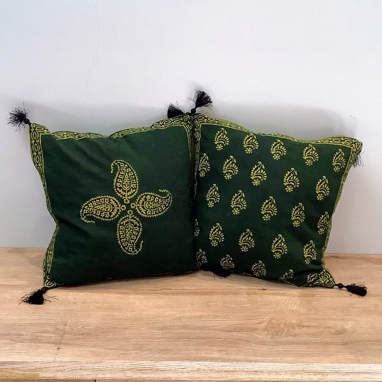 Double-sided Ajrak cushion cover showing a central keri motif on one side and repeating keri booti pattern on the other.